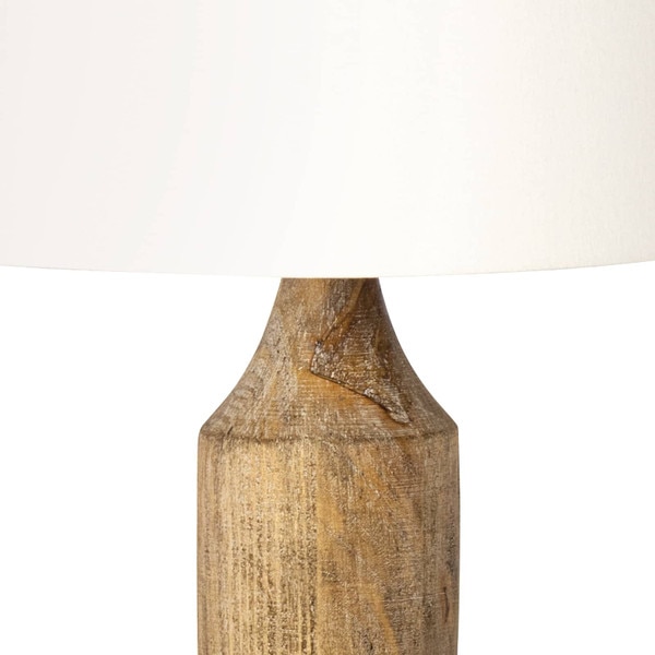 Base of a wood table lamp with a white lamp shade